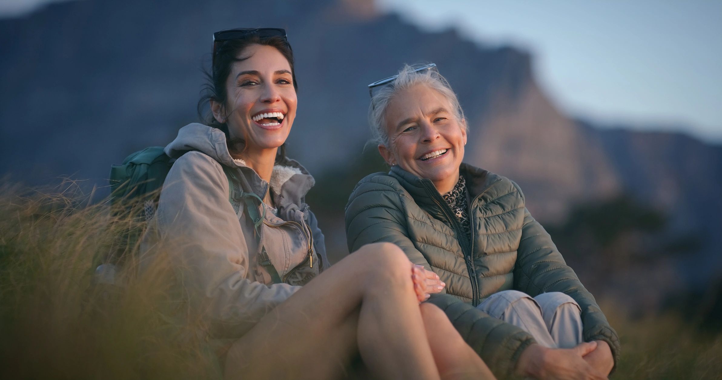 mom and daughter smiling together
